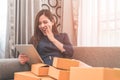 Asian Girl is addicted to online shopping, full of boxes