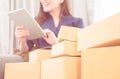 Girl is addicted to online shopping, full of deliveries boxes Royalty Free Stock Photo