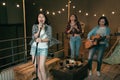 Asian girl bands practicing new songs on the roof
