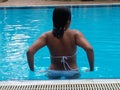 asian girl in bikini having afternoon swim