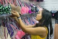 Asian girl buying bra at shop Royalty Free Stock Photo