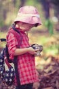 Asian girl checking photos in digital camera. Vintage picture st Royalty Free Stock Photo