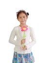 Asian girl child holding artificial flower giving for you isolated over white background Royalty Free Stock Photo