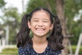 Asian girl child showing front teeth with big smile Royalty Free Stock Photo