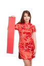 Asian girl in chinese cheongsam dress with red blank sign Royalty Free Stock Photo