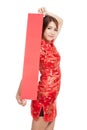 Asian girl in chinese cheongsam dress with red blank sign
