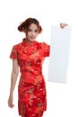 Asian girl in chinese cheongsam dress with red blank sign. Royalty Free Stock Photo