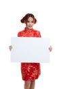 Asian girl in chinese cheongsam dress with red blank sign. Royalty Free Stock Photo