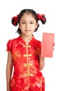 Asian girl in chinese cheongsam dress with red envelope Royalty Free Stock Photo