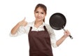 Asian girl cooking thumbs up with frying pan