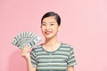 Asian girl counting salary dollar note. Success wealth financial business cashflow currency bill payment concept