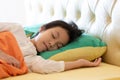 Asian girl deep sleeping on her bed with little smiling dream,good health and relaxation