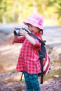 Asian girl with digital camera in beautiful outdoor. Royalty Free Stock Photo