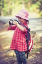 Asian girl with digital camera in beautiful outdoor. Retro style Royalty Free Stock Photo