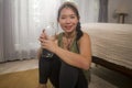 Asian girl doing fitness at home - young beautiful and happy Chinese woman drinking water bottle cheerful after sport workout Royalty Free Stock Photo