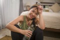 Asian girl doing fitness at home - young beautiful and happy Chinese woman drinking water bottle cheerful after sport workout Royalty Free Stock Photo