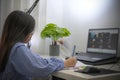 Asian girl doing homework or online education Royalty Free Stock Photo