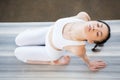 Asian girl doing Yoga in backward bending pose with eyes closed Royalty Free Stock Photo