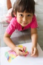 Asian girl drawing a picture.
