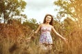 Asian girl in dress in field Royalty Free Stock Photo