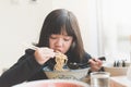 Asian girl eating chashu ramen in japanese restaurant Royalty Free Stock Photo