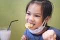 Asian girl eating in chinese restuarant