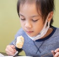 Asian girl eating in chinese restuarant