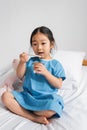 asian girl eating delicious yogurt and Royalty Free Stock Photo