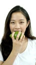 Asian girl eating fruit, avocado. Clean food, healthy and weight