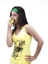 Asian girl eating a green apple Royalty Free Stock Photo