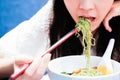 Asian girl eating noodle in Chinese restaurant Royalty Free Stock Photo