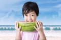 Asian girl eating slice of watermelon Royalty Free Stock Photo