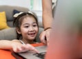 Asian girl elementary student use laptop for online education Royalty Free Stock Photo