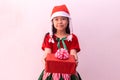 Asian girl in Elf clothes holding gift. Merry christmas Royalty Free Stock Photo