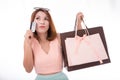 Asian girl enjoy shopping wiht credit card and shopping bag isolate on white background Royalty Free Stock Photo