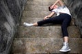 Asian girl fallen down steps Royalty Free Stock Photo