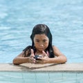 Asian girl girl in water in swimming pool