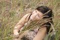 Asian girl among grass Royalty Free Stock Photo