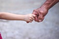 Asian girl hand holding old man hand for family background Royalty Free Stock Photo