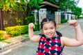 Asian girl happily walking and relaxing in front of the house. with a smiling face in the morning Royalty Free Stock Photo