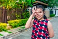 Asian girl happily walking and relaxing in front of the house. with a smiling face in the morning Royalty Free Stock Photo