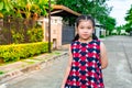 Asian girl happily walking and relaxing in front of the house. with a smiling face in the morning Royalty Free Stock Photo