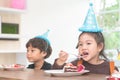 Asian girl happy eating her birthday cake Royalty Free Stock Photo