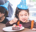 Asian girl happy eating her birthday cake Royalty Free Stock Photo