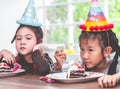 Asian girl happy eating her birthday cake Royalty Free Stock Photo