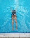 asian girl having afternoon swim in pool Royalty Free Stock Photo