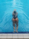 asian girl having afternoon swim in pool