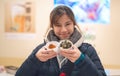 Asian girl having japanese Snack in a Izagaya bar and restuarant