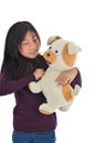 Asian girl holding puppy doll on white background..