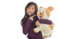 Asian girl holding puppy doll on white